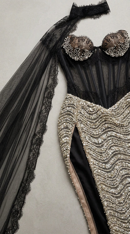 Close-up flat lay of corset bodice with crystal-embellished cups and lace choker cape