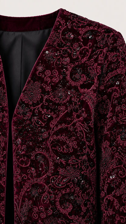 Close up detail of burgundy paisley burnout velvet fabric and lining
