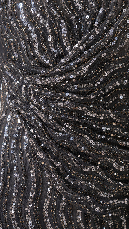 Close-up of ruched waist detail and wavy sequin pattern