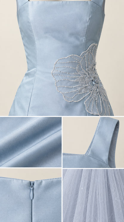 Detailed close up of beaded floral embroidery, satin bodice texture, strap, and tulle skirt fabric