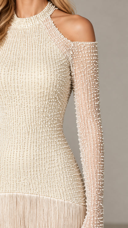 Close up of pearl beadwork and fringe detail on champagne evening dress