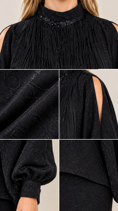 Close-up details of embellished neckline, shoulder cutout, textured fabric, and sleeve cuff