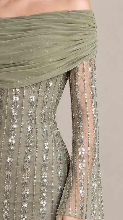 Close-up of Sage Green gathered off-the-shoulder neckline and linear sequin fabric