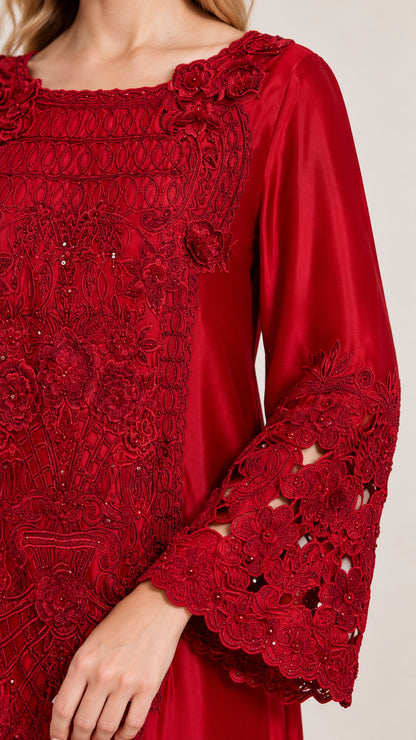 Close-up of intricate red chest embroidery and cutout lace bell sleeve detail