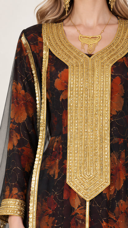 Close-up detail of intricate gold-toned embroidered neckline and metallic trim on black floral fabric