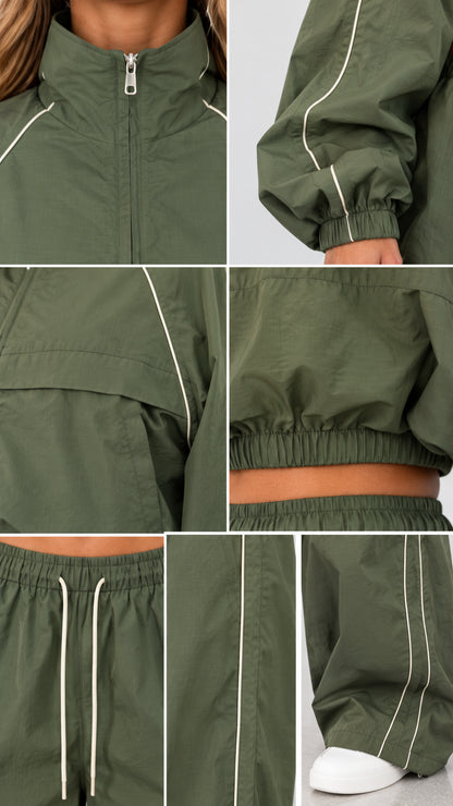 Detailed close-up views of zipper, collar, piping, and elastic drawstring hem in olive green