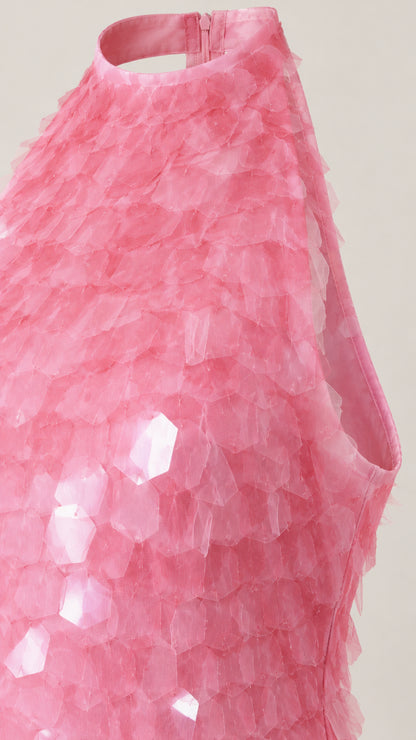 Close-up detail of pink 3D petal texture and halter neckline