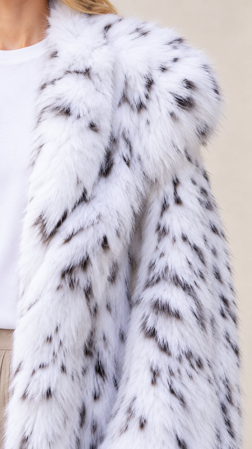 Close-up detail of plush speckled faux fur lapel and texture