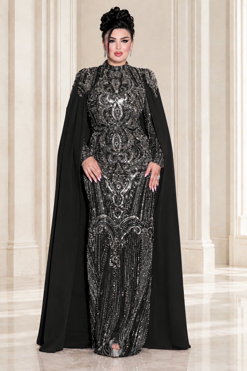 Model wearing black sequin embroidered high neck cape formal gown