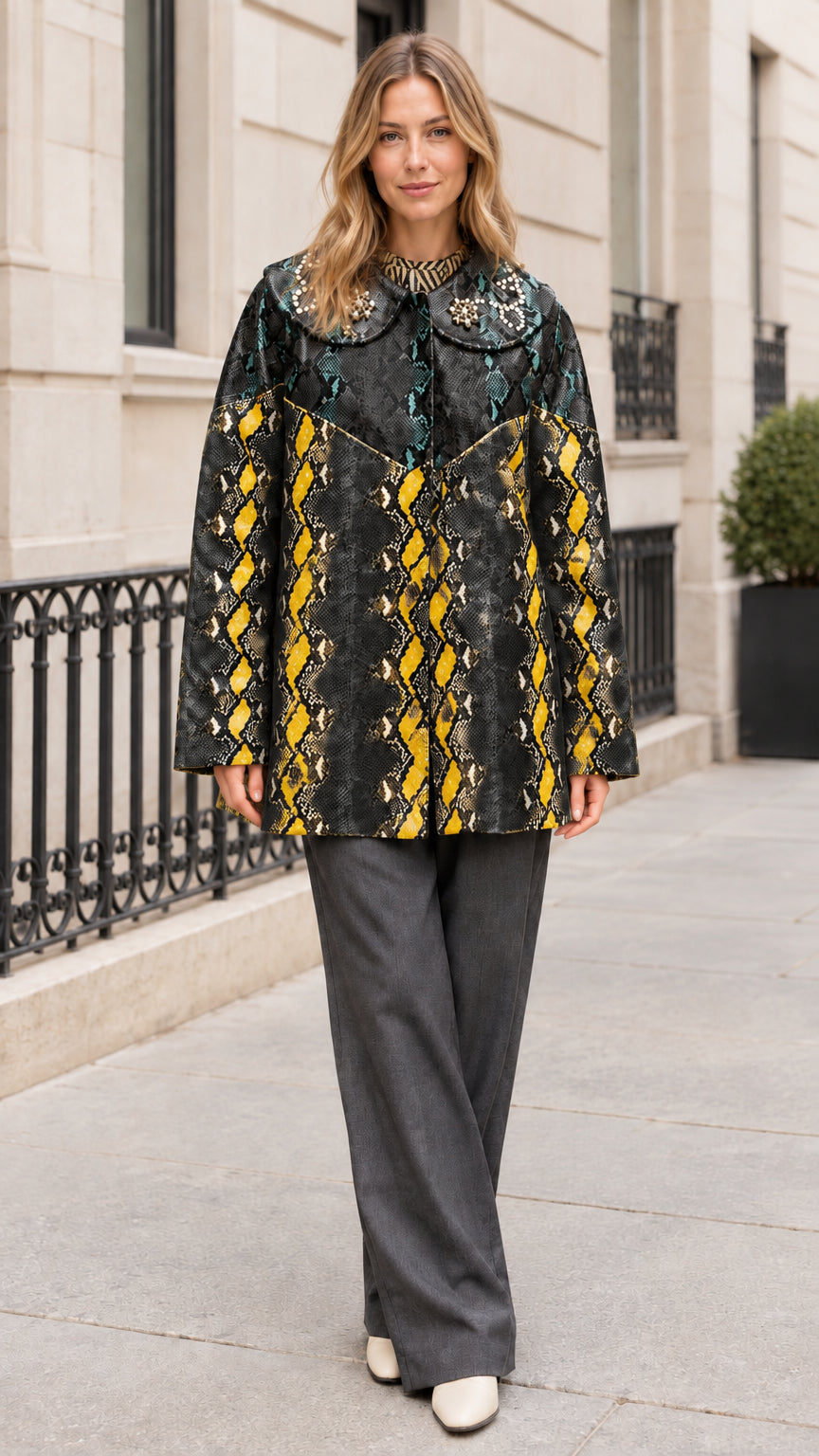 Model wearing Black Yellow snakeskin print coat