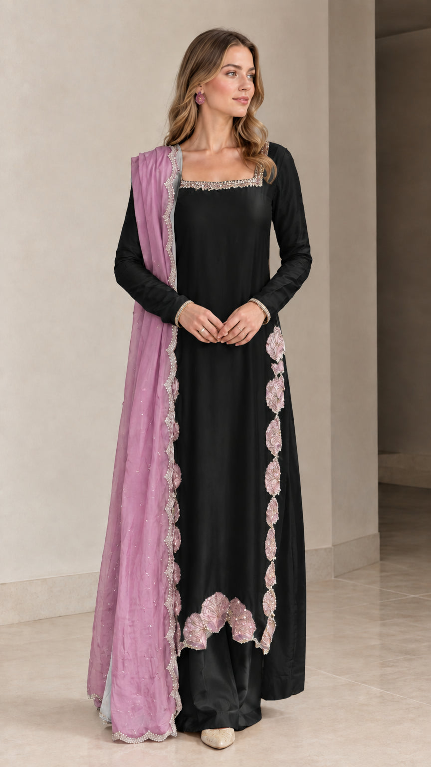 Model wearing Black embroidered 3-piece kurta set with contrasting dupatta