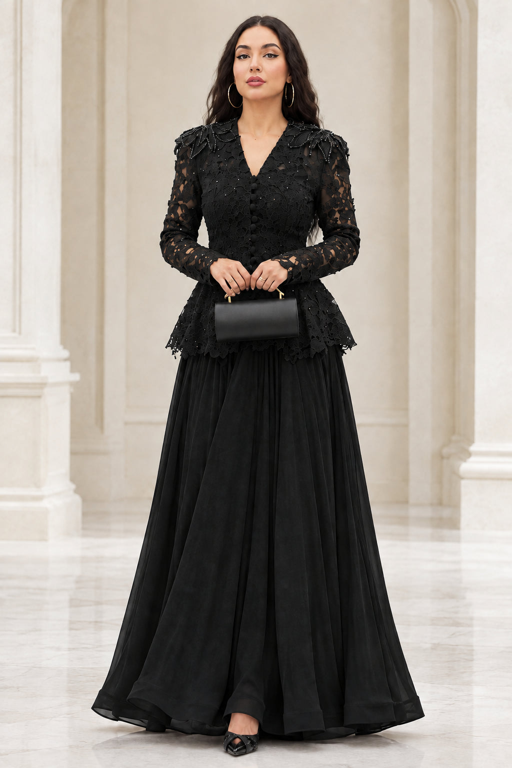 Model wearing black long sleeve lace peplum maxi evening gown