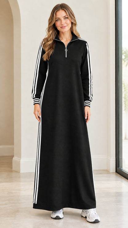Front view of black long sleeve half-zip sporty maxi dress with white stripes