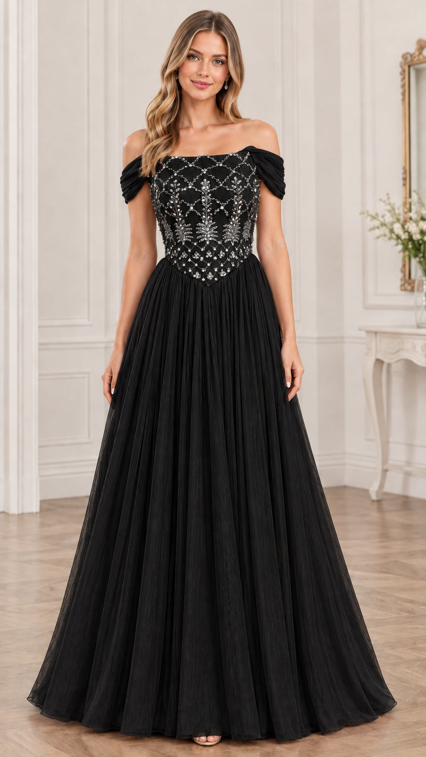 Model wearing black off-the-shoulder beaded tulle evening dress