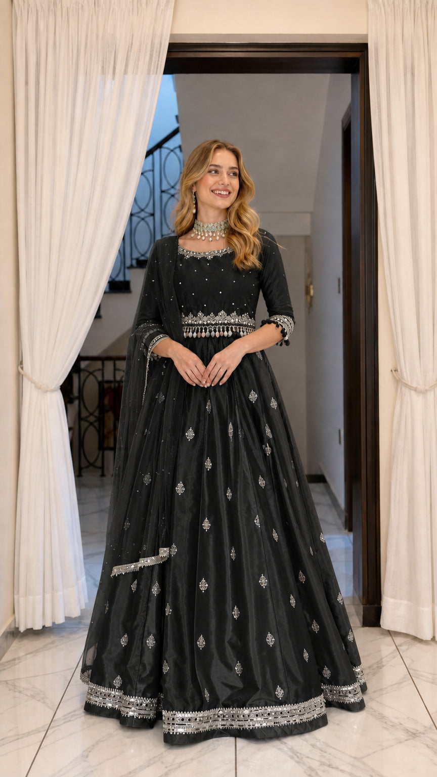 Model wearing black embroidered flared Anarkali maxi dress with matching black dupatta