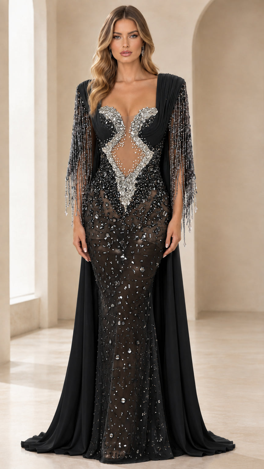 Front view of black crystal embellished evening dress with beaded fringe and matching cape