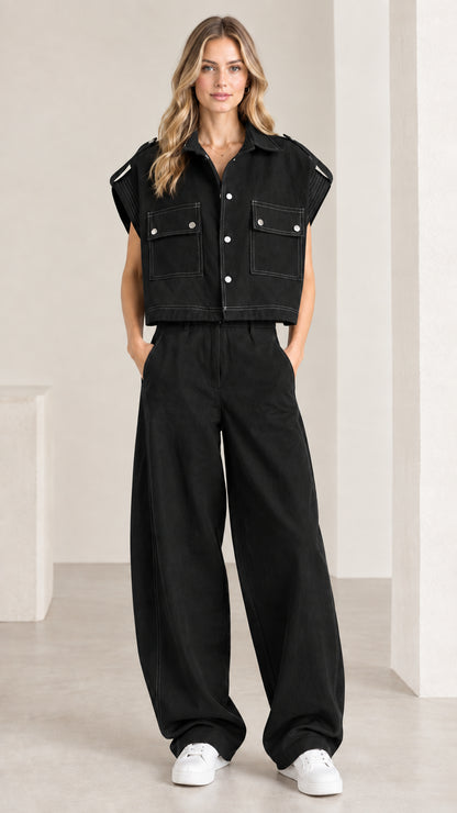 Front view of woman wearing black utility cropped shirt and wide-leg pant set