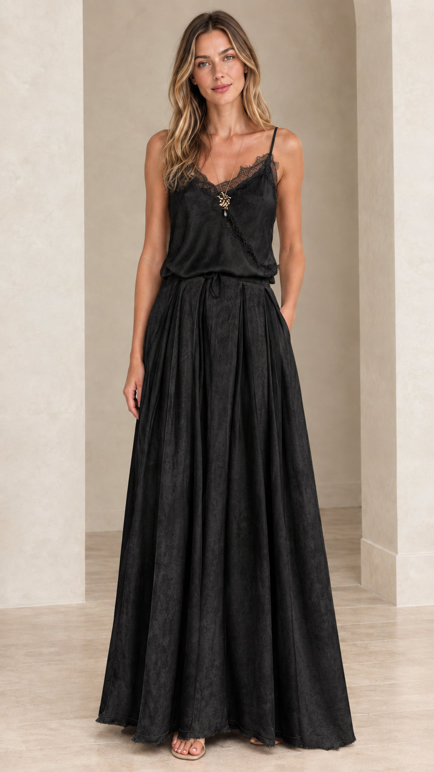 Model wearing black lace-trim cami maxi dress