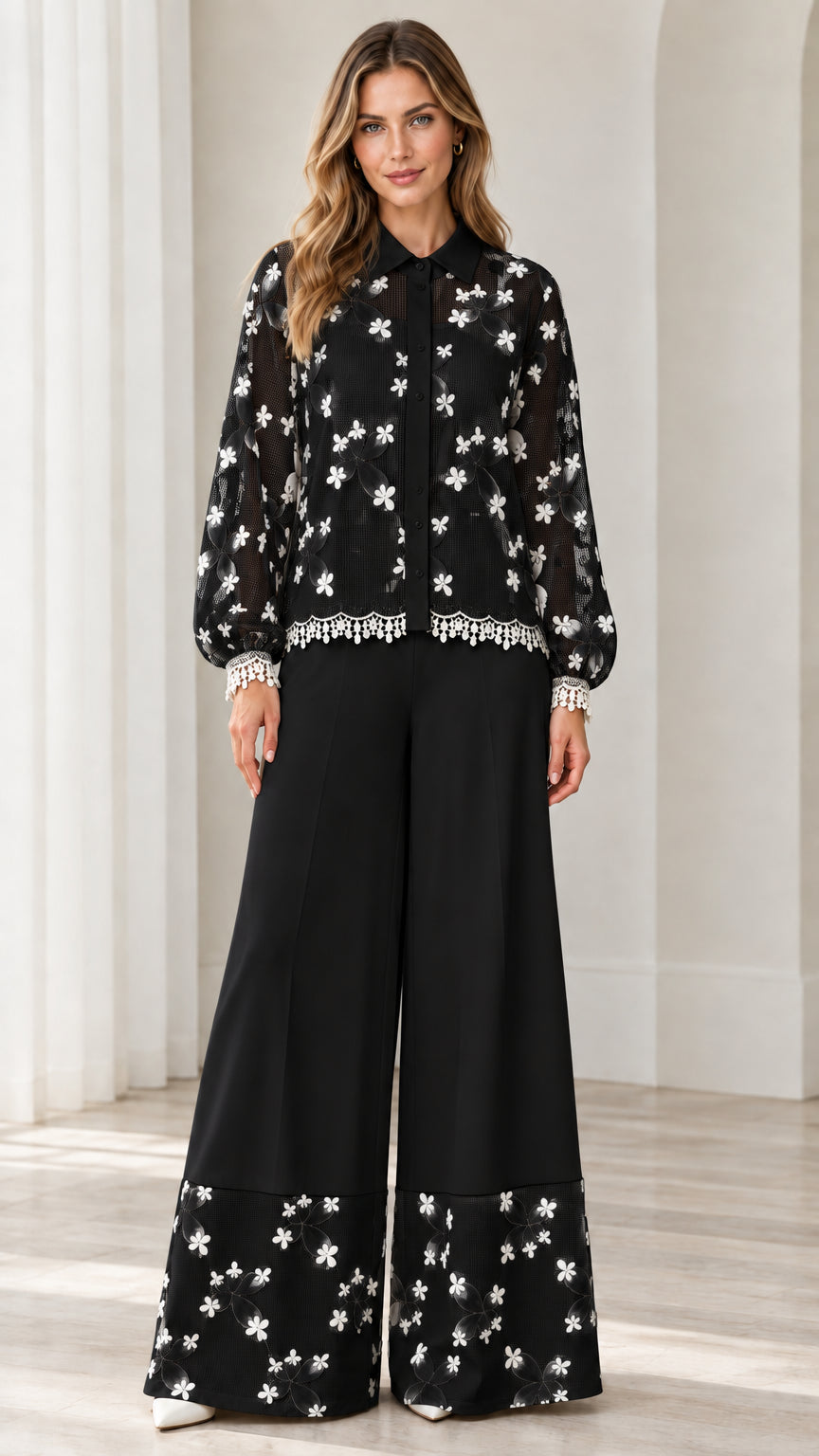 Model wearing black floral embroidered lace shirt and wide leg pant set