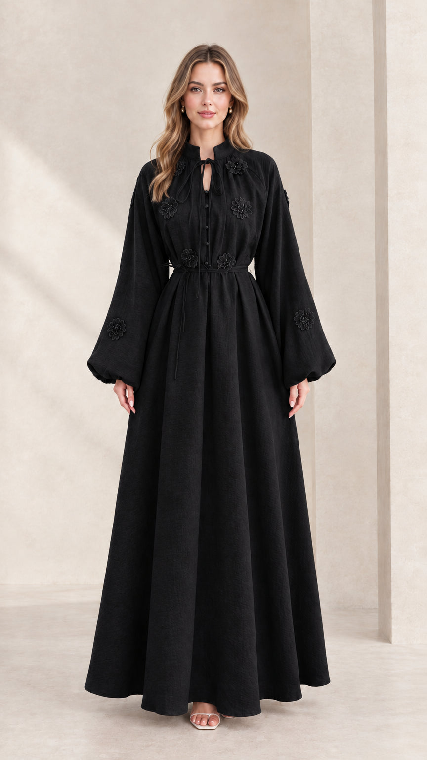 Front view of black embroidered tie-neck lantern sleeve maxi dress