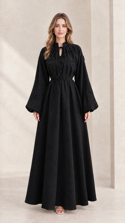 Front view of black embroidered tie-neck lantern sleeve maxi dress