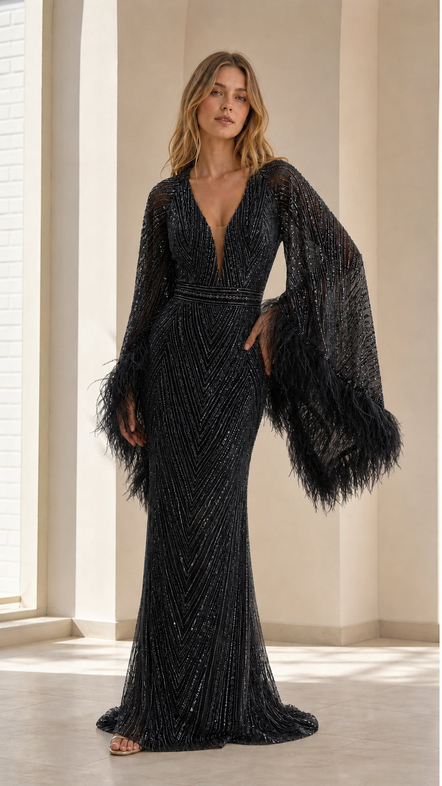 Front view of model wearing black sequin evening gown with black feather trim cuffs