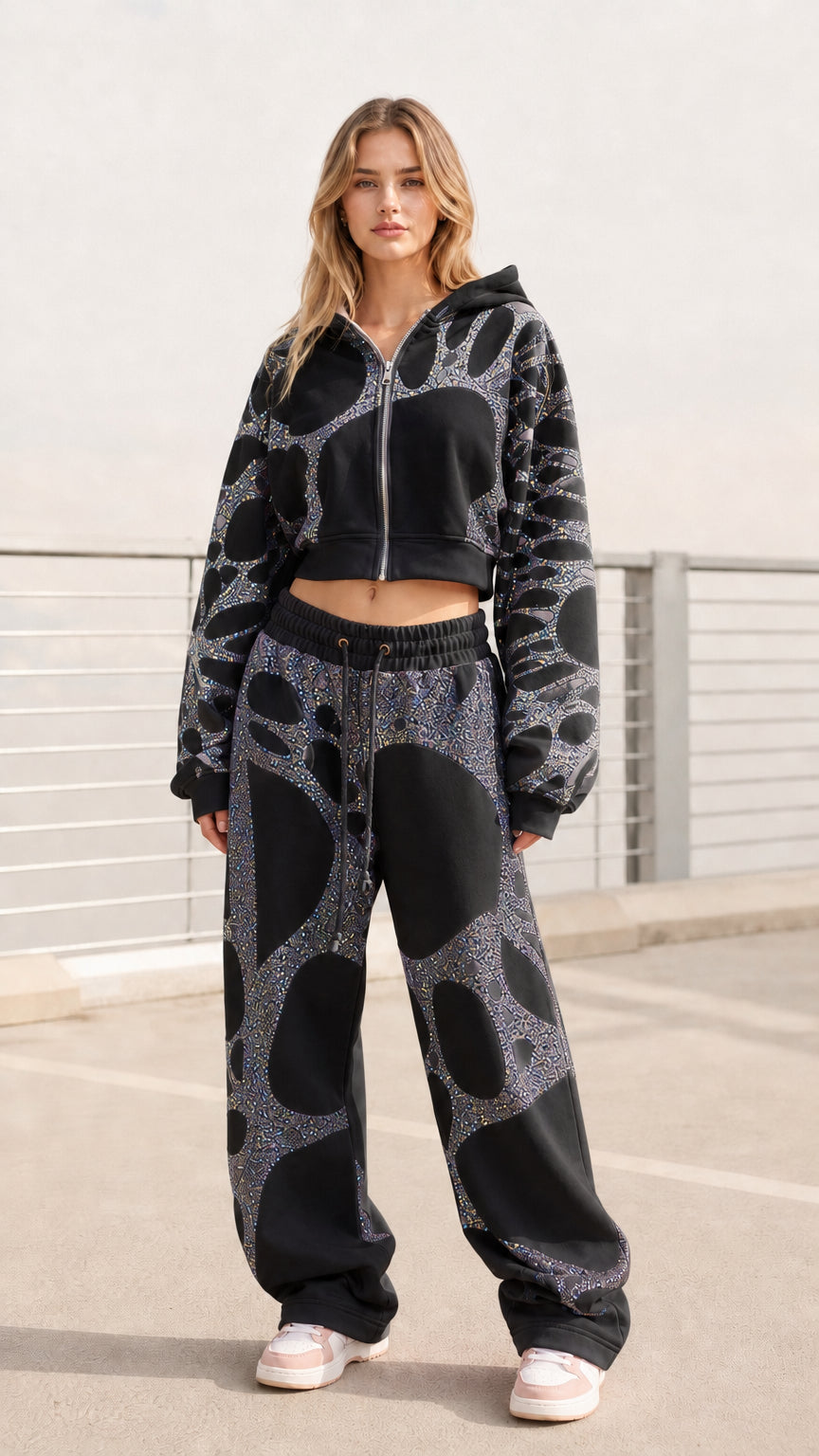 Women's black cropped zip-up hoodie and baggy sweatpants set with silver glitter pattern