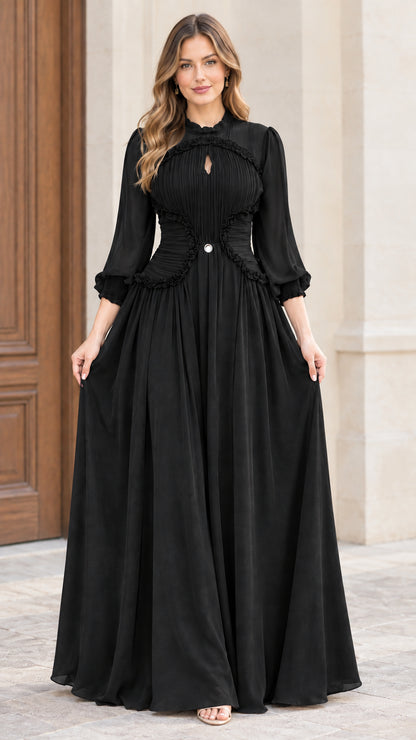 Front full-length view of woman wearing black pleated long sleeve chiffon maxi dress