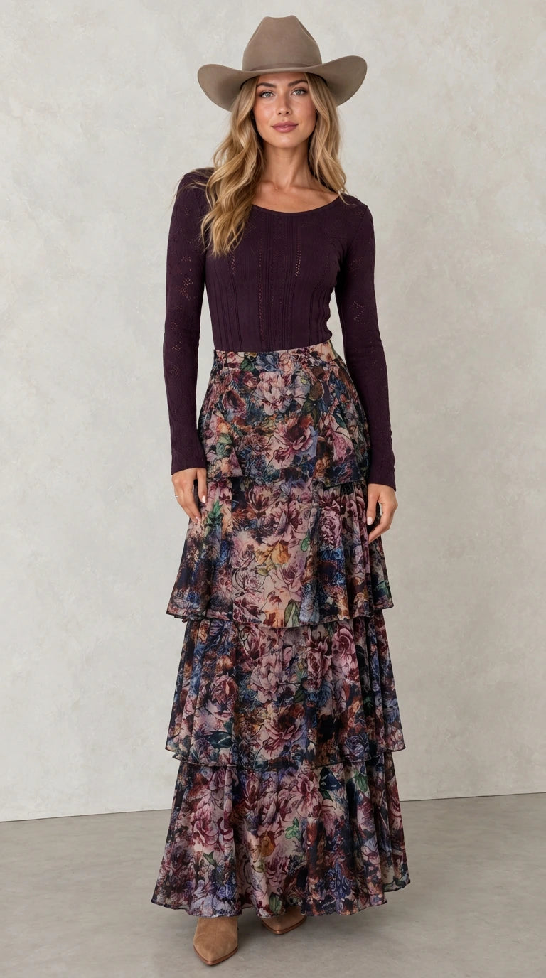Model wearing Midnight Navy tiered floral maxi skirt with dark long sleeve top
