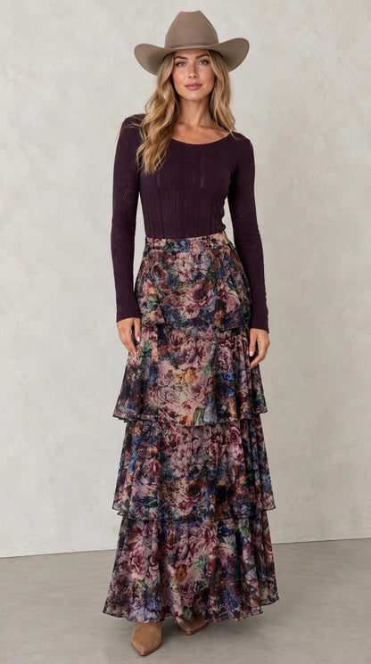 Model wearing Midnight Navy tiered floral maxi skirt with dark long sleeve top