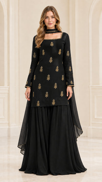 Model wearing classic black embroidered kurta sharara suit set