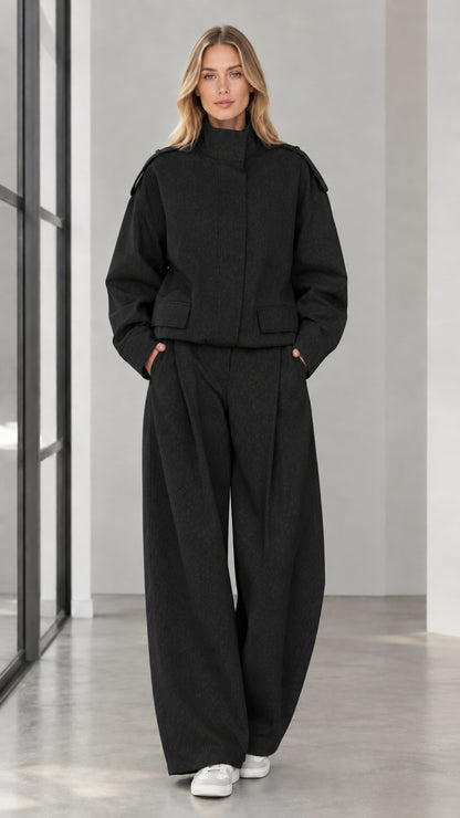 Full front view of woman wearing Black stand collar cropped jacket and wide leg trousers set