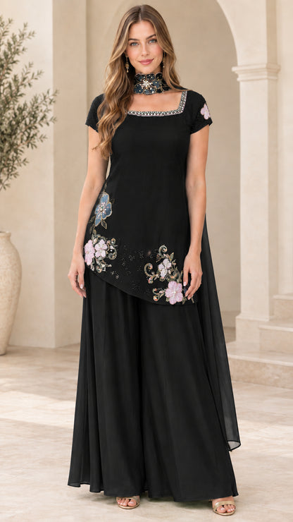 Front view of model wearing Black floral embroidered tunic and palazzo set