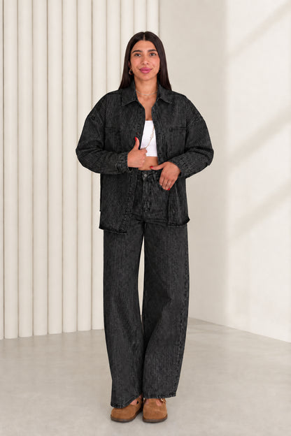 Model wearing washed black striped denim shacket and wide leg pants set