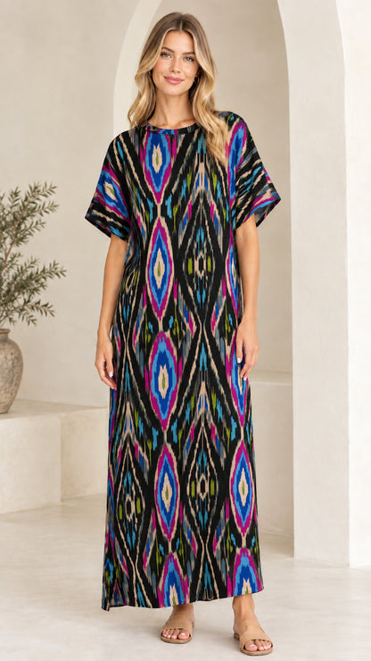 Woman wearing Black Multi ikat print short sleeve maxi dress