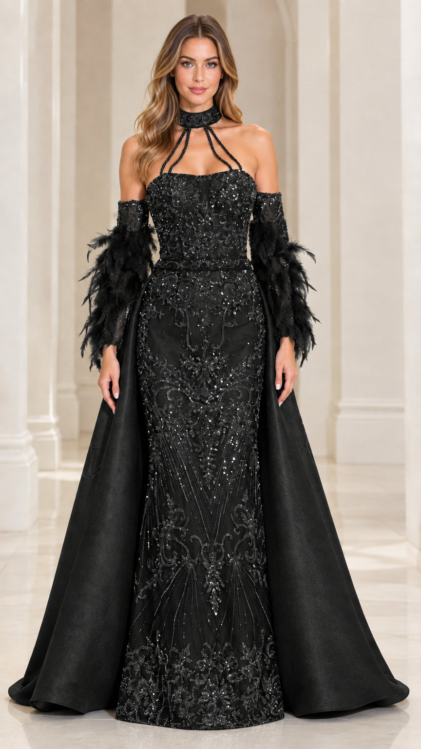 Front view of model wearing Black sequin mermaid evening gown with satin overskirt and feather cuffs