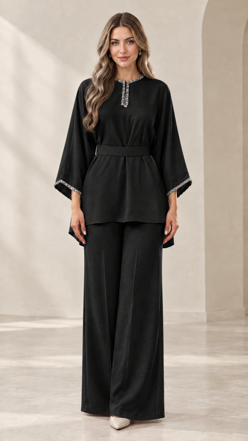 Full-length front view of black rhinestone-embellished tunic top and wide-leg pants set