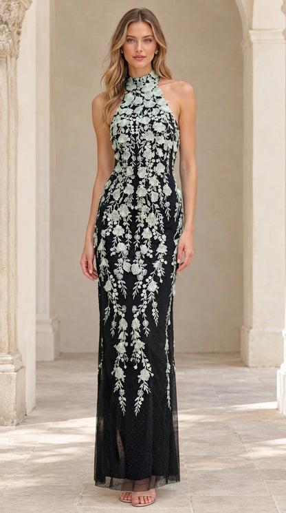 Model wearing Black floral embroidered halter maxi formal dress
