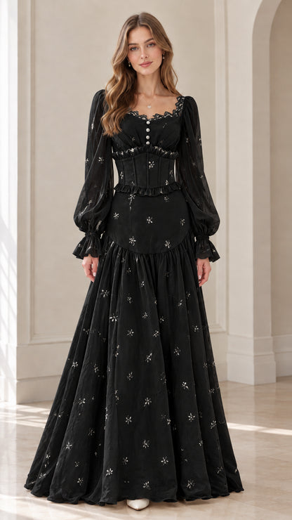 Front view of model wearing black corset-style long sleeve maxi dress