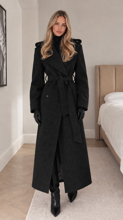 Full-length black belted maxi trench coat on model