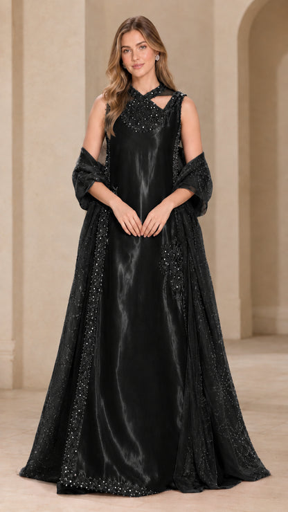 Full-length view of black satin evening gown with beaded neckline and sheer wrap