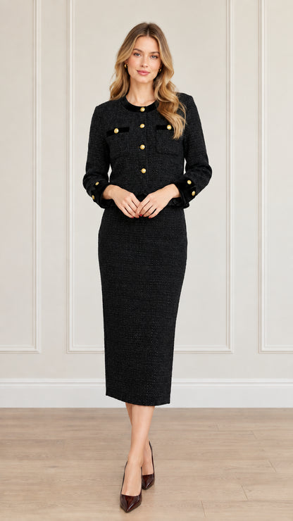 Full-length front view of women's black tweed skirt suit set with contrast trim