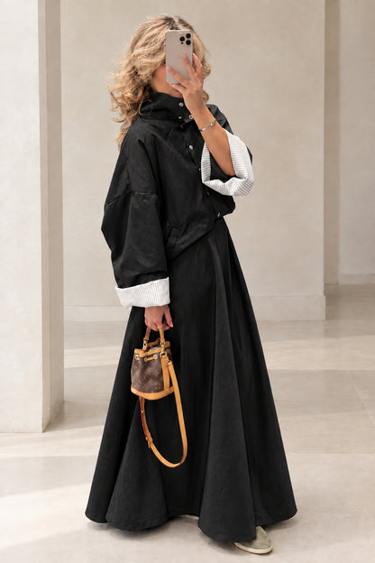 Full-length view of woman wearing Black jacket and maxi skirt two-piece set