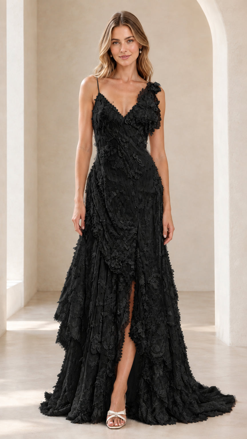 Front view of model wearing the black 3D floral tiered lace maxi evening dress