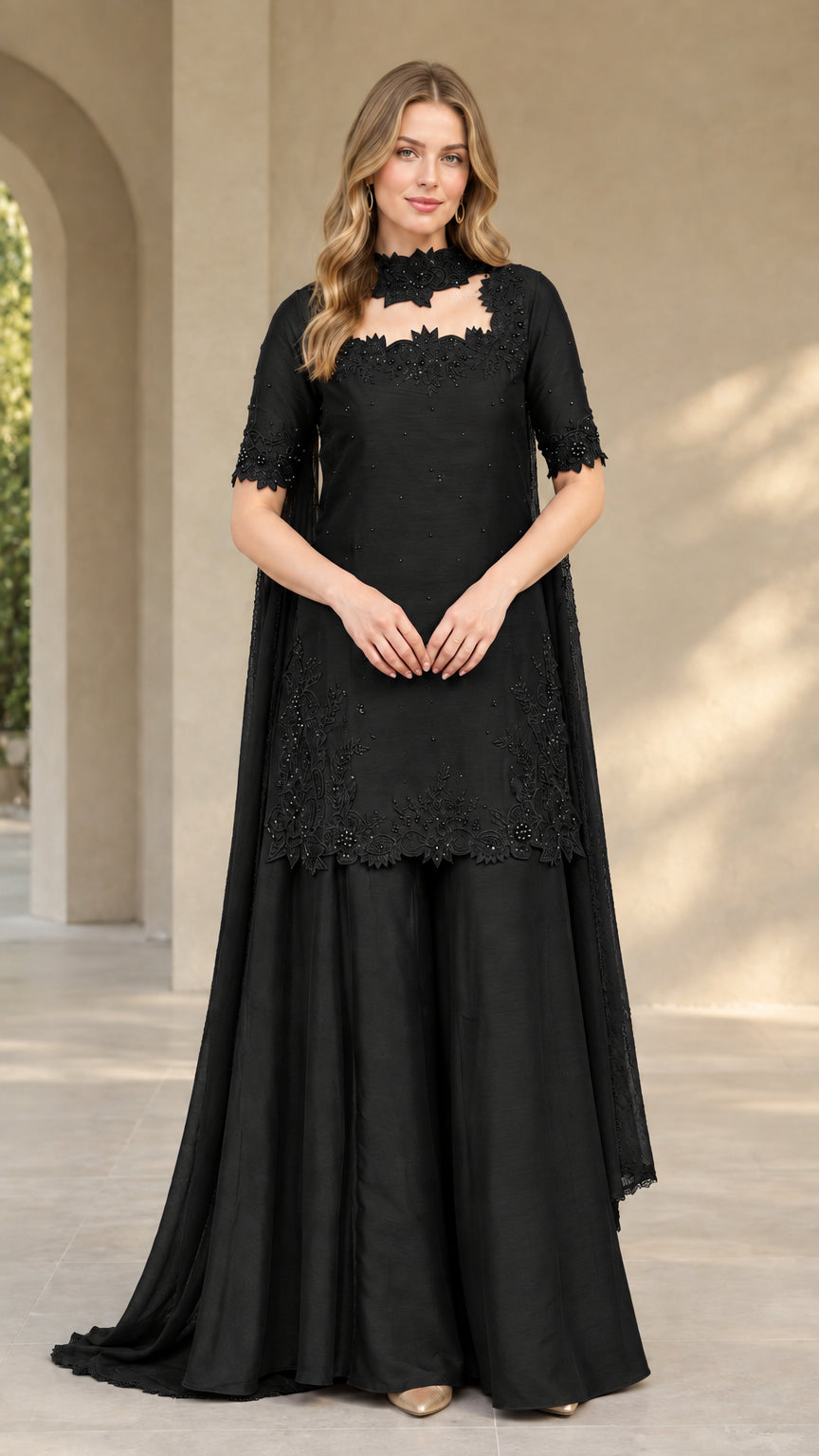 Front view of black embroidered cutout tunic and palazzo set