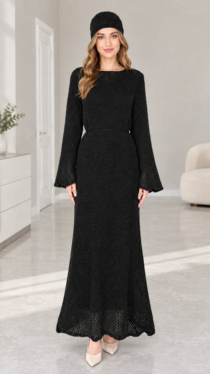 Front view of woman wearing Black pointelle knit long sleeve maxi dress