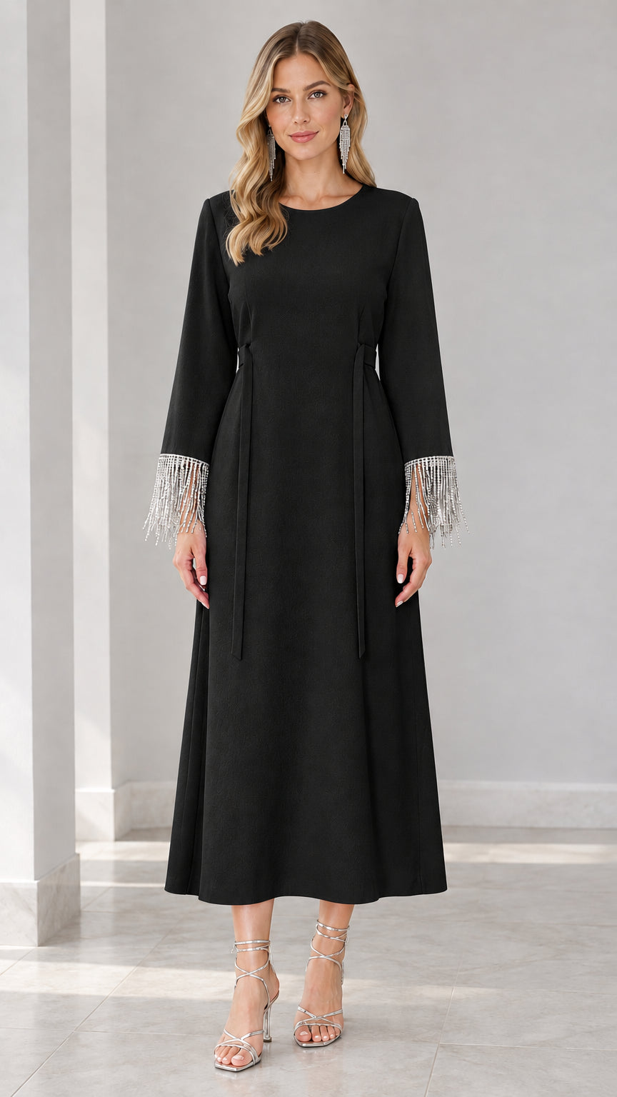 Front view of black long sleeve maxi dress with crystal fringe sleeves