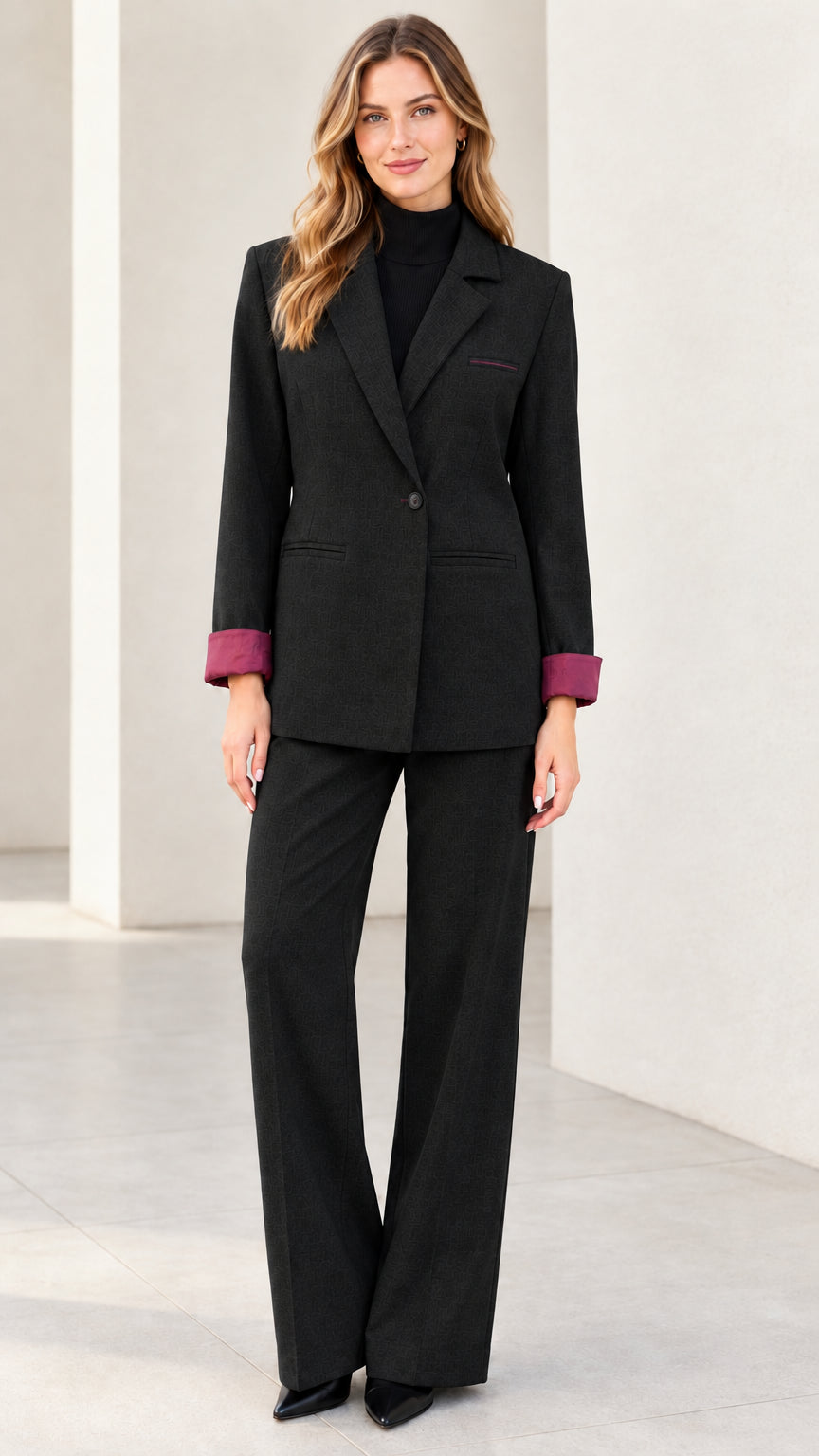 Front full view of women's classic black two-piece blazer and trouser suit set