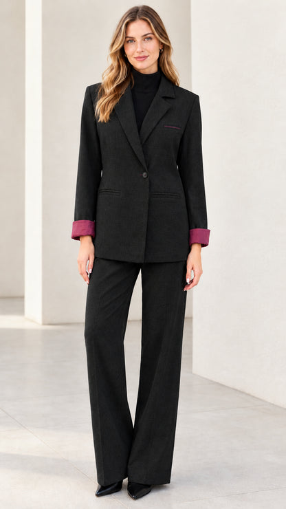 Front full view of women's classic black two-piece blazer and trouser suit set