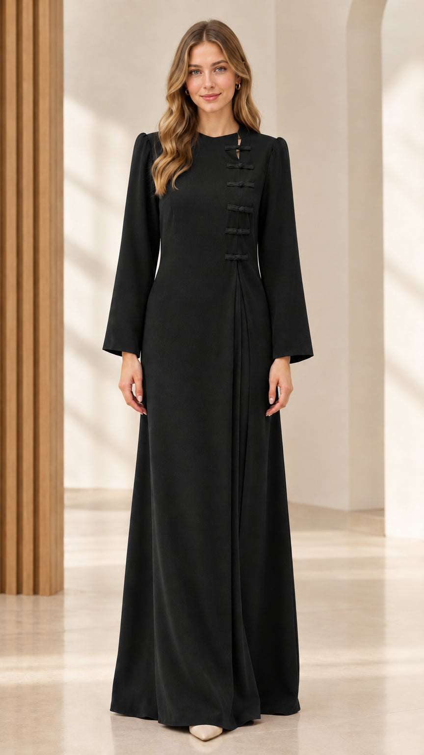 Front view of black long-sleeve maxi dress with frog knot detailing